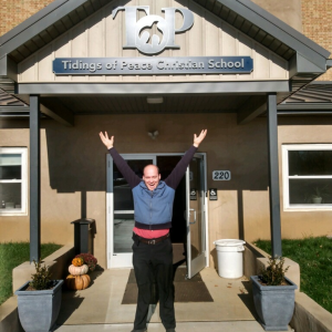 Mr Shenk with new TOPCS sign